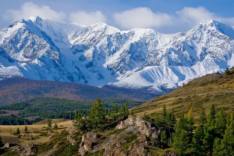 Wan 3.0 clip: snow-covered mountain range above larch-covered hills in the Altai