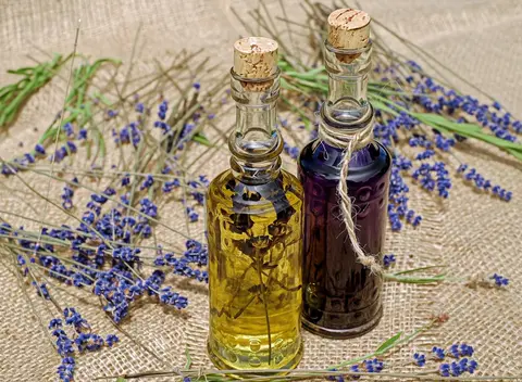 FLUX 3 clip: two corked glass bottles of lavender oil on burlap with lavender stems