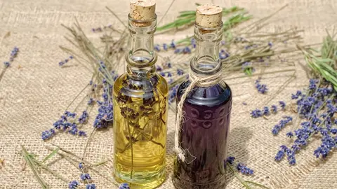 Gemini Omni Flash clip: two corked glass bottles of lavender oil on burlap with lavender stems