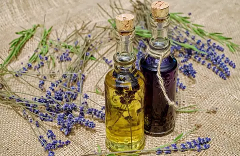 Hailuo H3 clip: two corked glass bottles of lavender oil on burlap with lavender stems