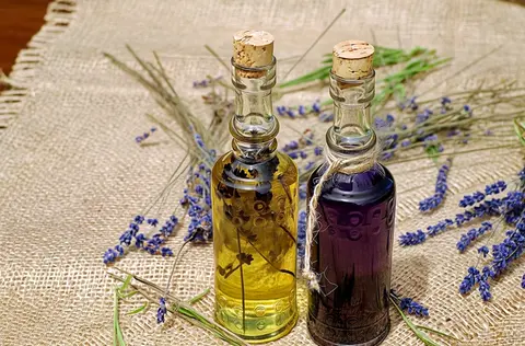Happy Horse 1.1 clip: two corked glass bottles of lavender oil on burlap with lavender stems
