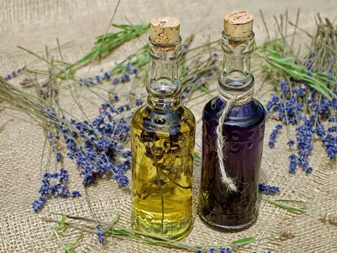 Luma Ray 3.2 clip: two corked glass bottles of lavender oil on burlap with lavender stems