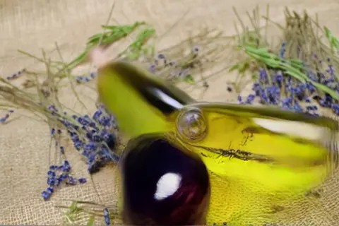 Pika 2.2 clip: two corked glass bottles of lavender oil on burlap with lavender stems