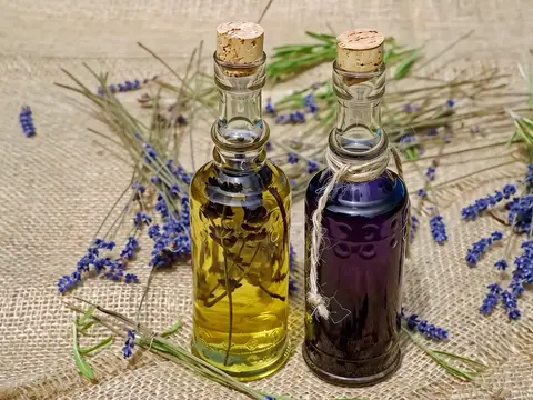 Seedance 2.0 clip: two corked glass bottles of lavender oil on burlap with lavender stems
