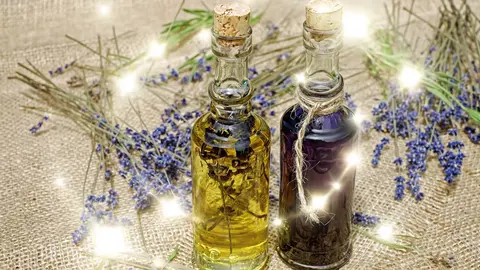 Veo 3.1 Fast clip: two corked glass bottles of lavender oil on burlap with lavender stems